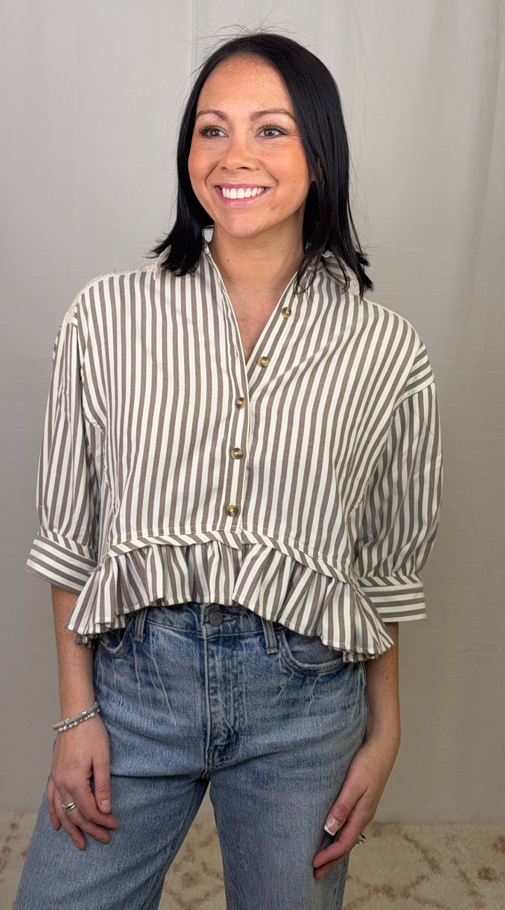 Striped button down peplum top worn with blue jeans