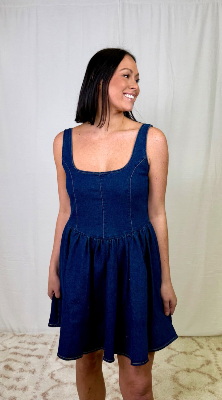 Dark wash fit and flare denim dress with wide straps and structured bodice