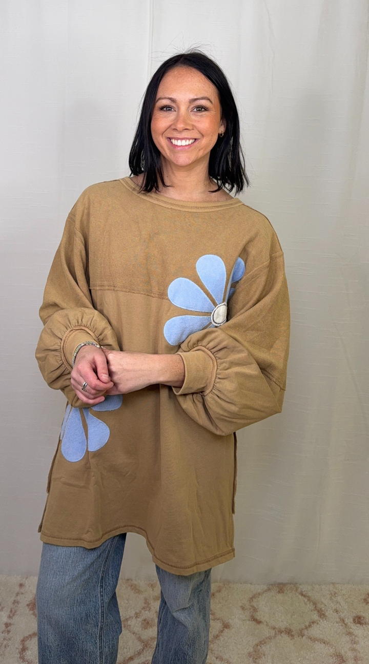 Oversized brown floral sweatshirt dress worn with jeans