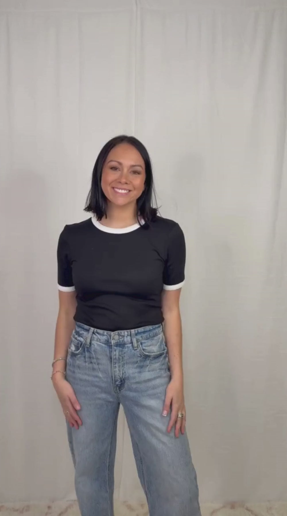 video Black and white contrast trim cotton top worn with blue jeans