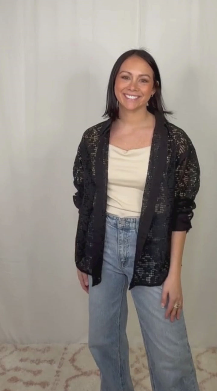video Black lace long sleeve button down top worn with blue jeans